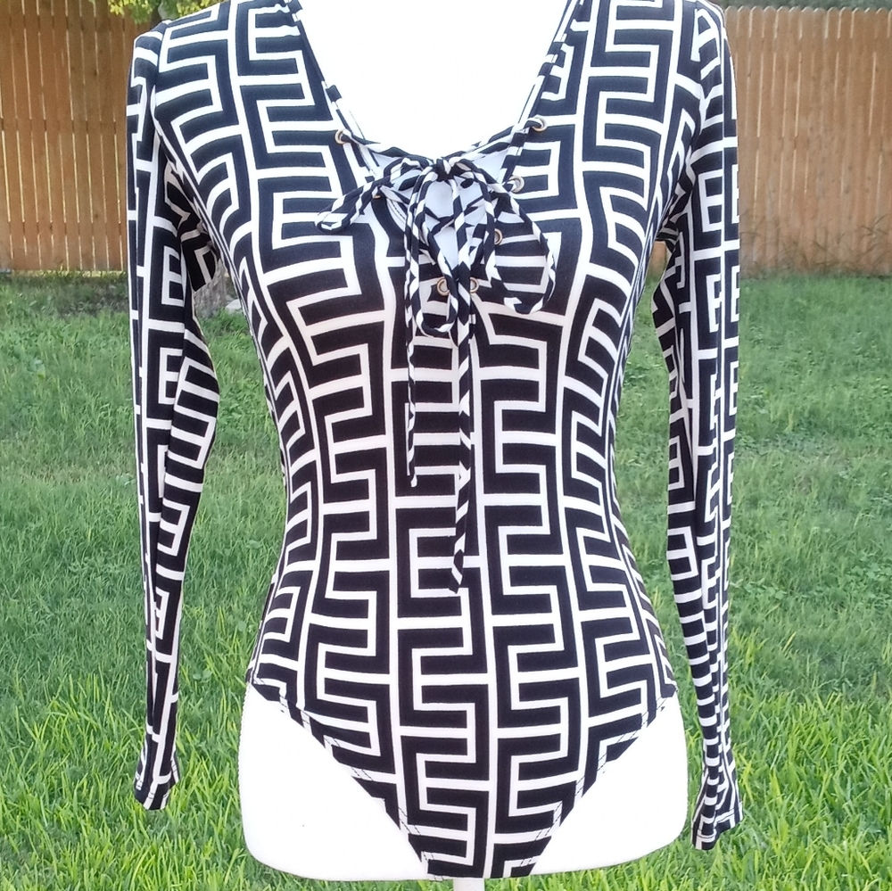 Woman bodysuit. White and black stretch material can be used as small or medium.